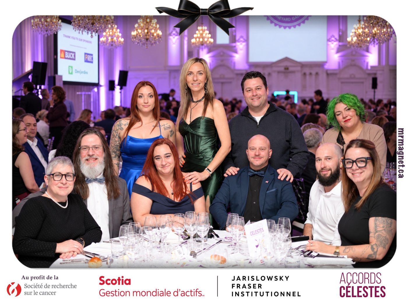 Guests gathered at a table in the grand ballroom, framed by the custom Accords Célestes magnet design