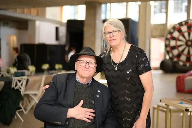 Couple posing in a bright event hall
